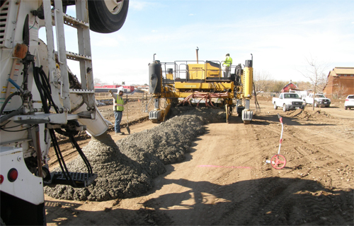 pouring concrete for slipform paver
