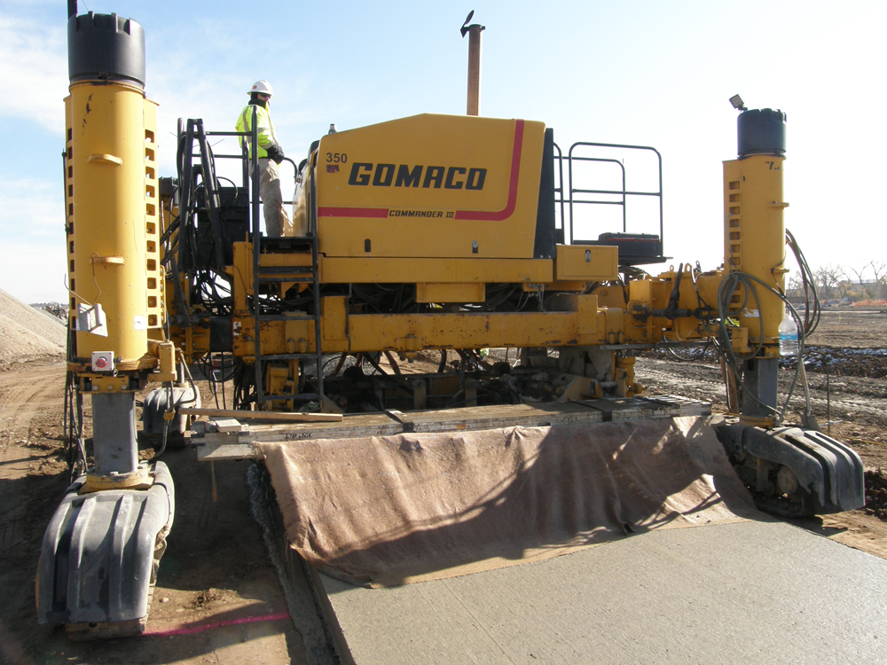 slipform paver spreading concrete