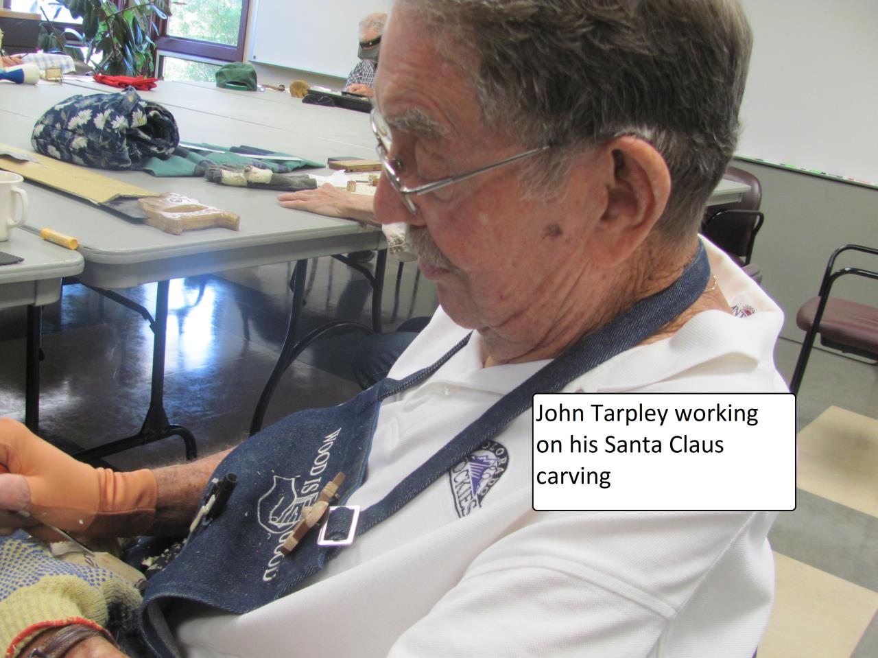 John Tarpley carving Santa Claus