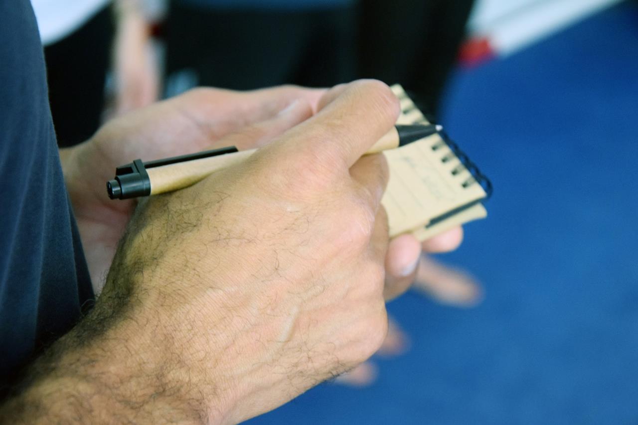 Hands with pen and notebook picture