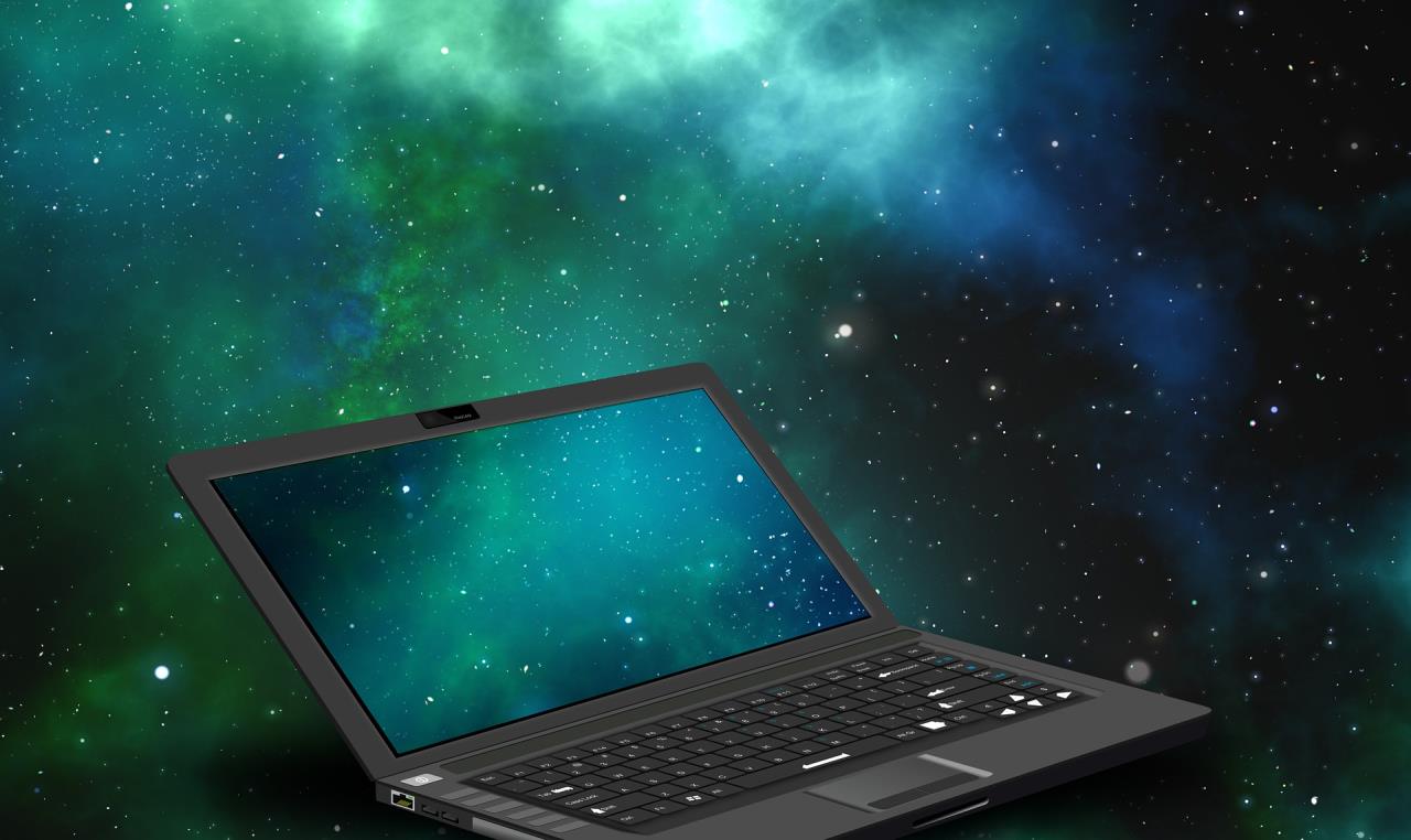 Laptop with Star Field on Screen and In Background