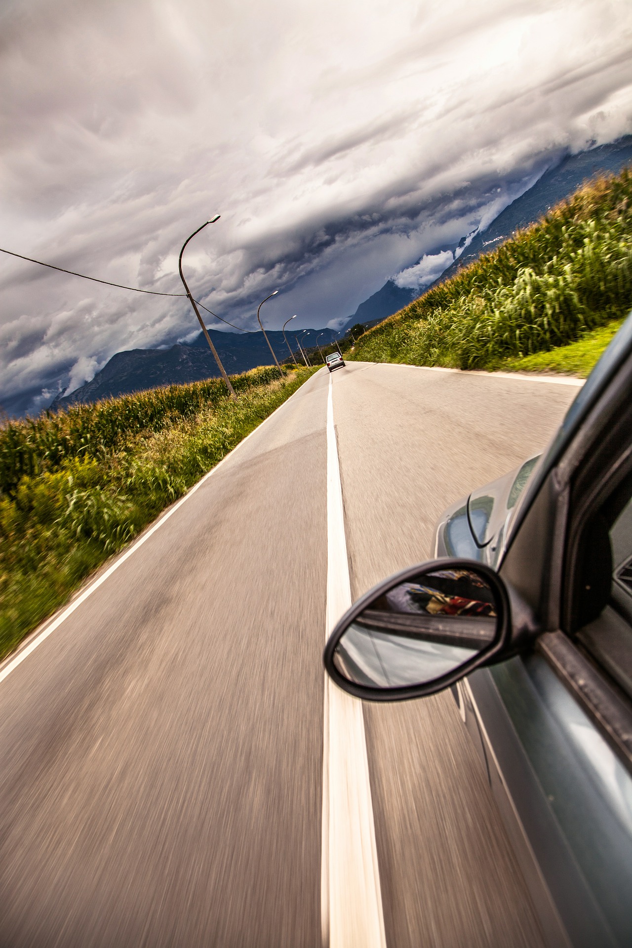 Fast driving car on lonely road