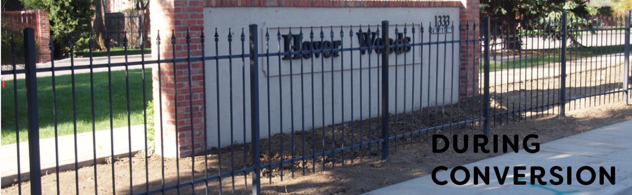 Area is cleared in front of the Hover Woods neighborhood entry sign in preparation of planting a water wise garden