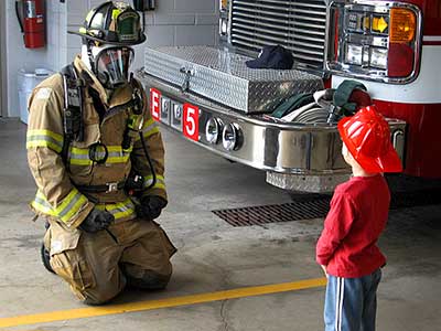 Firefighter and young recruit