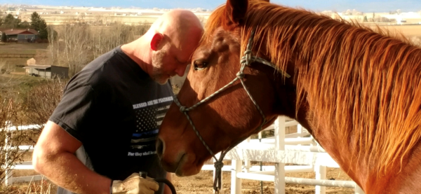Chris with his horse or as he says, My big boy. Bear a