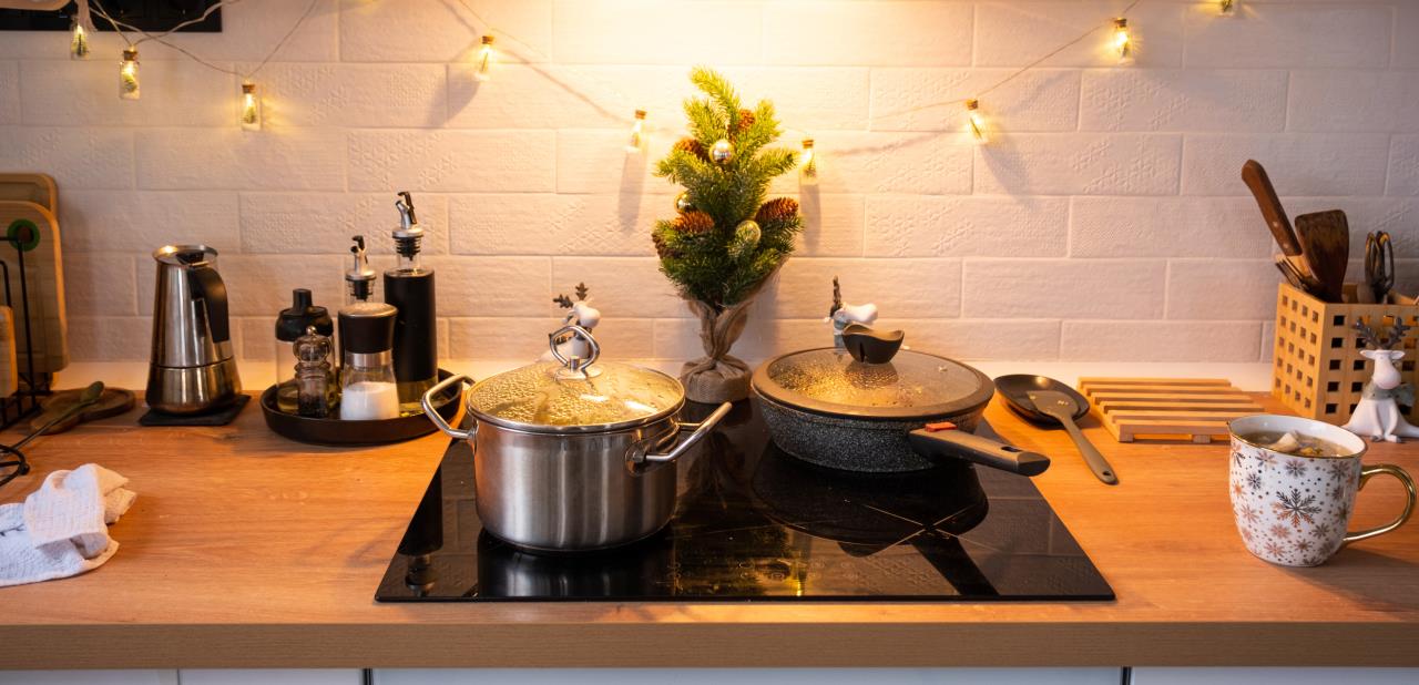 Pot and pan on induction cooking suface with holiday decor