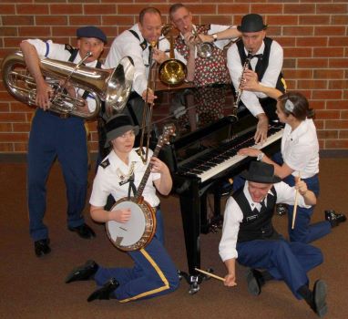 band members with horns around a piano