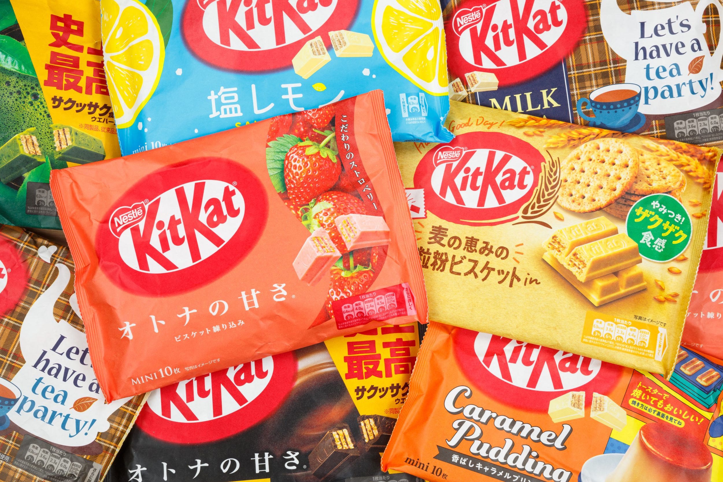 Different types of KitKat Kit Kat chocolate bars from Japan by Nestle company as background