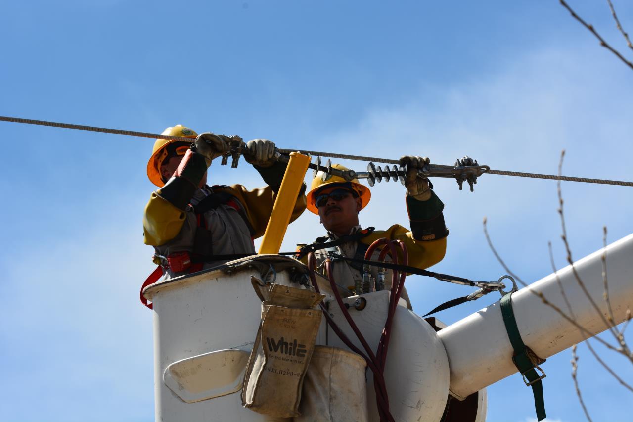 Lineworkers in Bucket Working on Power Line