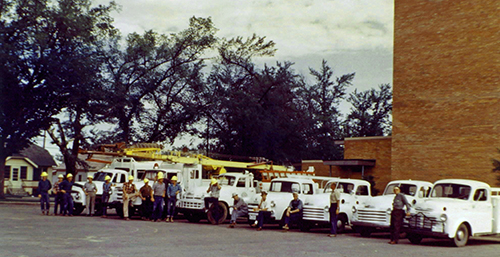 A row of cars in front of a building