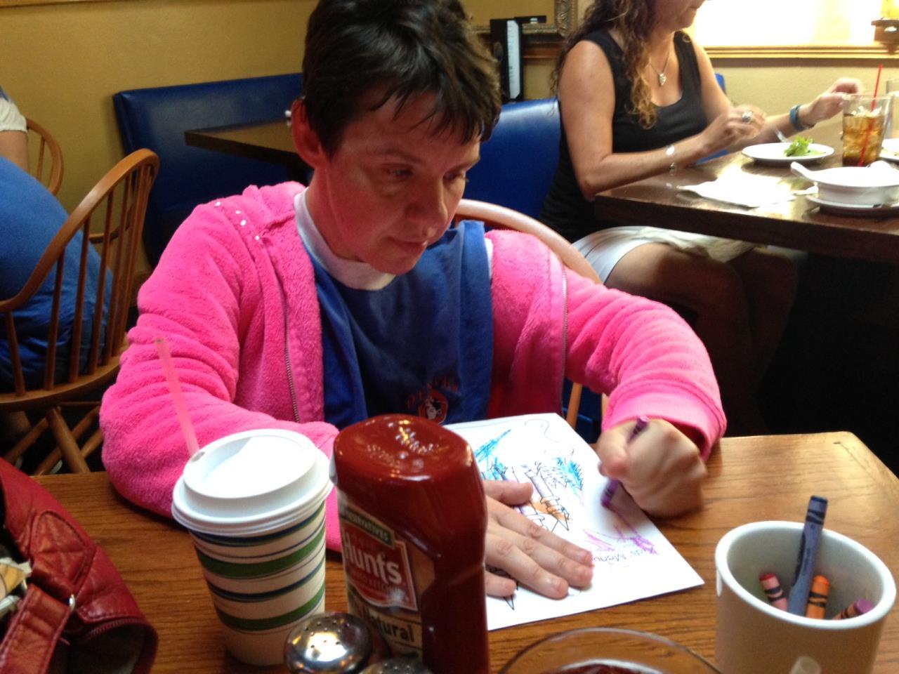 Missy coloring with crayons