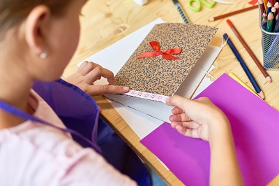 female making greeting cards crafting