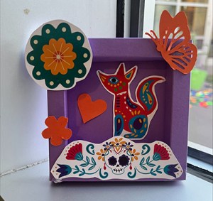 A purple box shows Mexican art like coyote, butterfly and sugar skulls