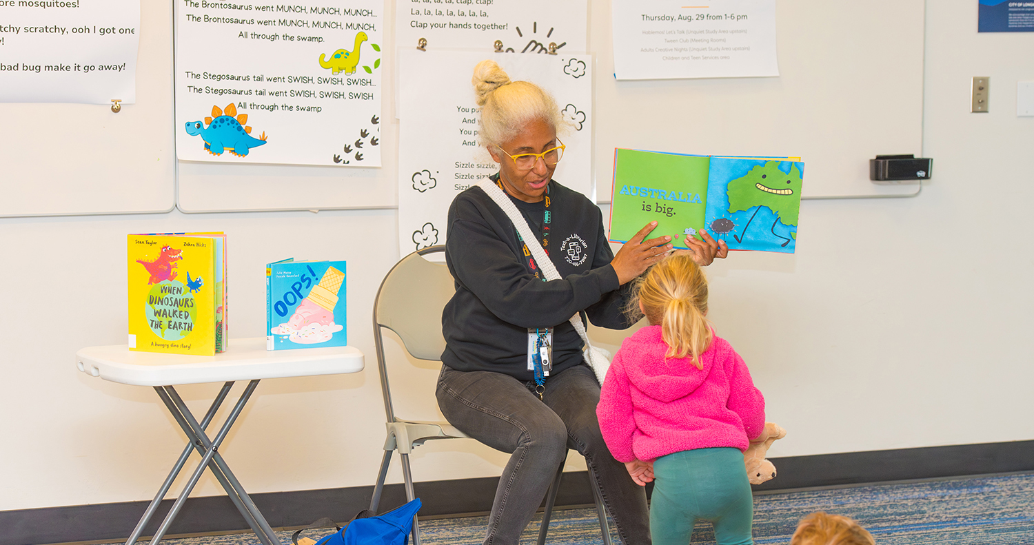 A Librarian reads to kids during storytime