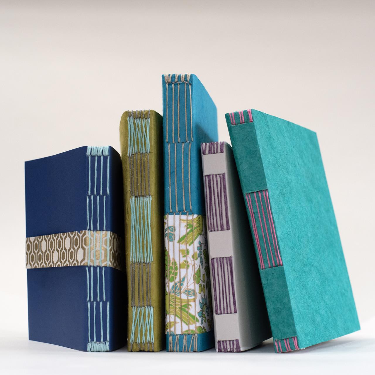 A stack of books bound with the Japanese long stitch method