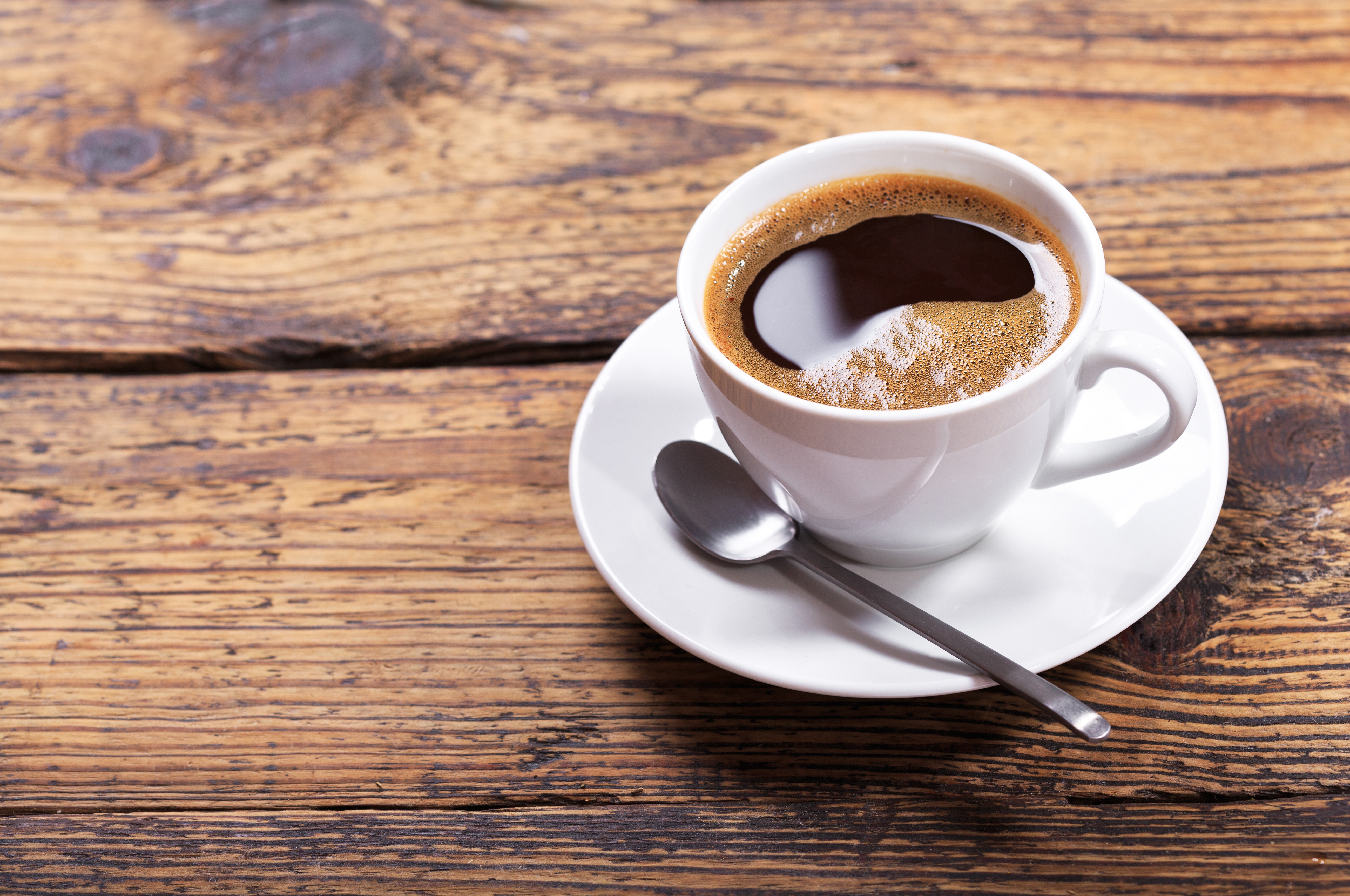 Cup of coffee on wooden table