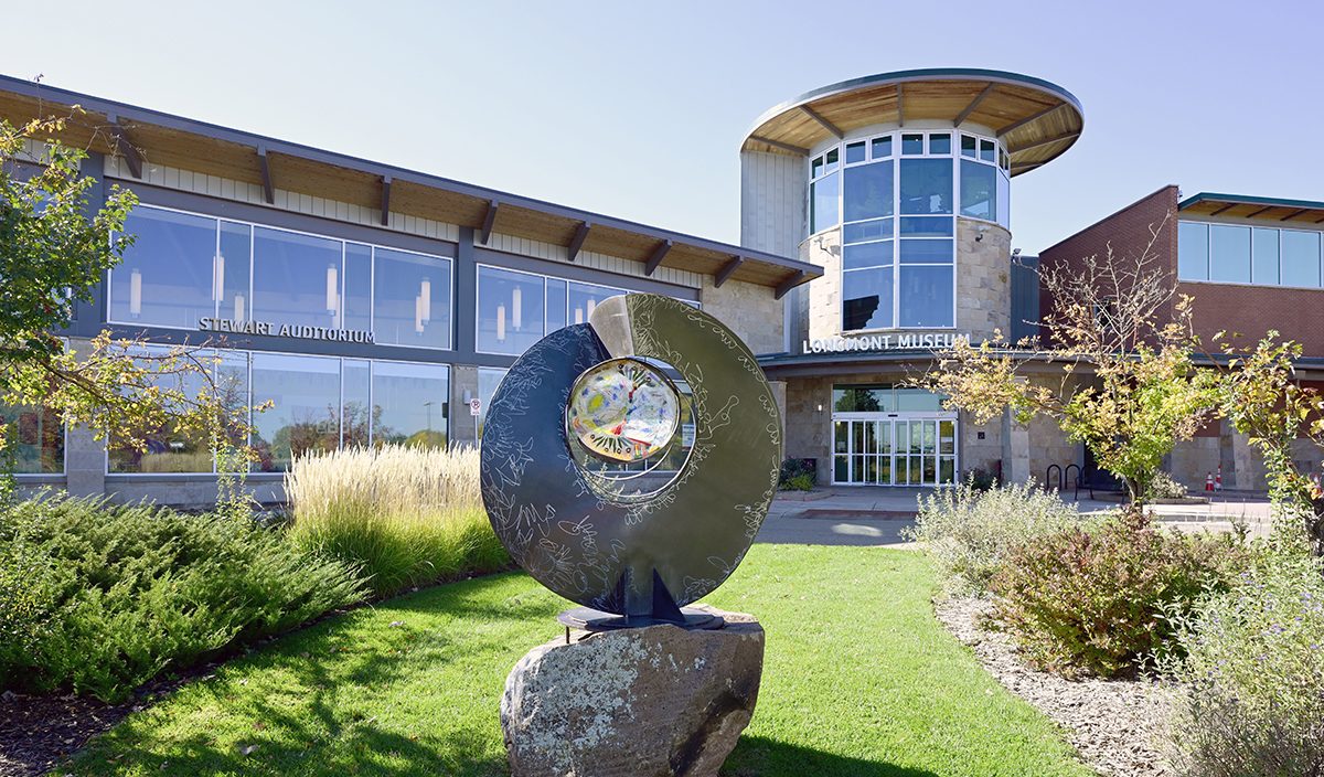 Museum exterior featuring glass windows and a sculpture