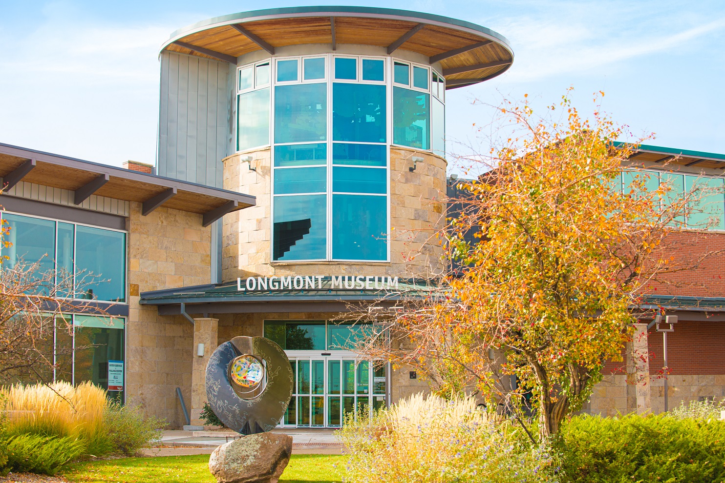 A contemporary building exterior featuring a rotunda with windows