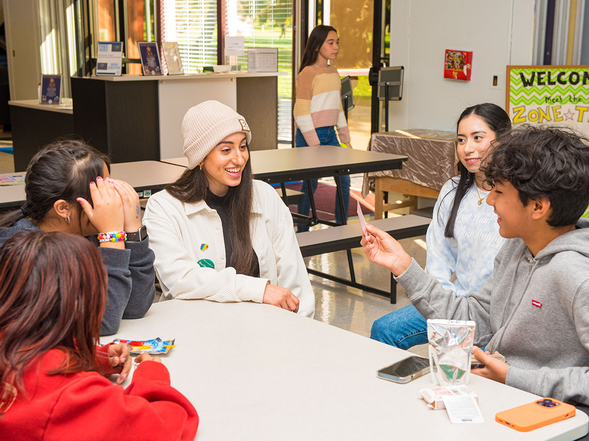 Youth and staff share a laugh at the Longmont Youth Center.