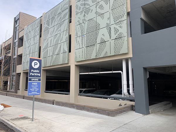 The Spoke parking garage is viewed from Coffman Street.