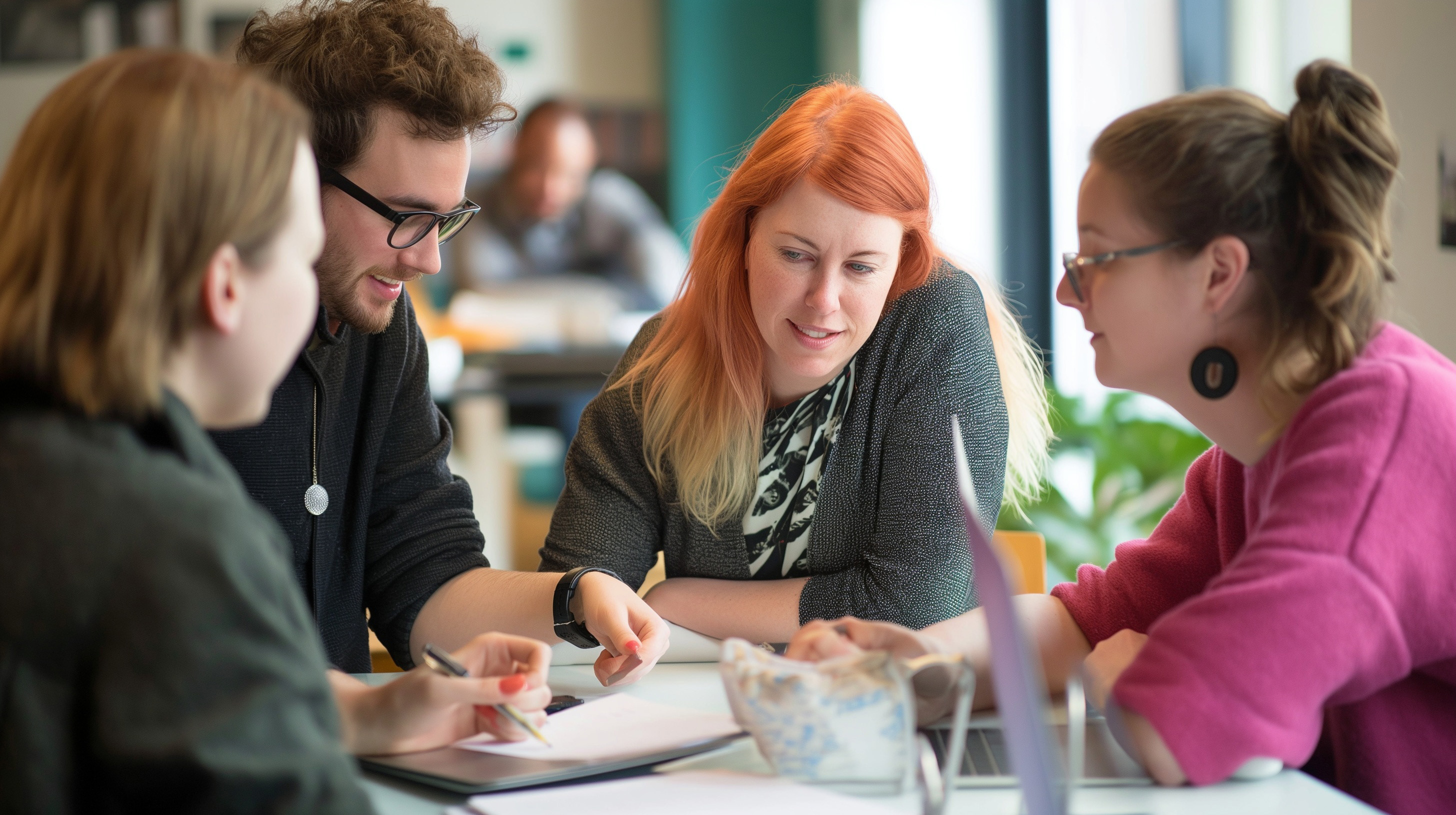 A group of writers collaborating on a blog post or article for the company's website