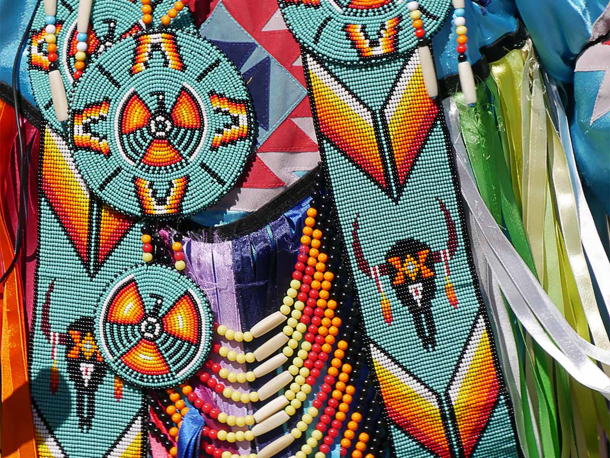 A variety of colorful Native American beadwork is displayed.