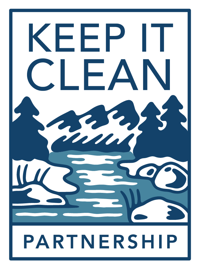 A logo of a river with rocky banks with trees and mountains in the background. The logo includes the text Keep it Clean Partnership