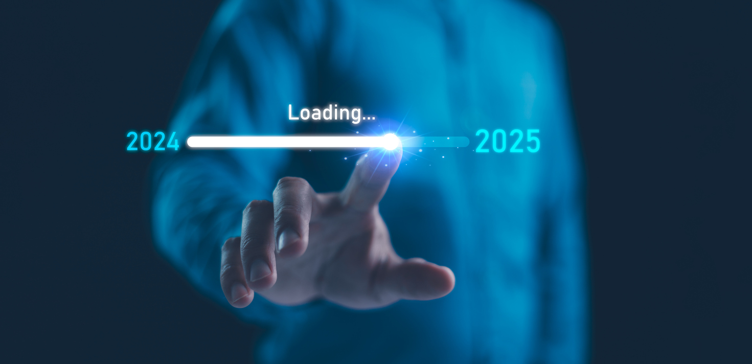 Finger touching a "Loading" screen, with a progress meter that moves from 2024 to 2025.