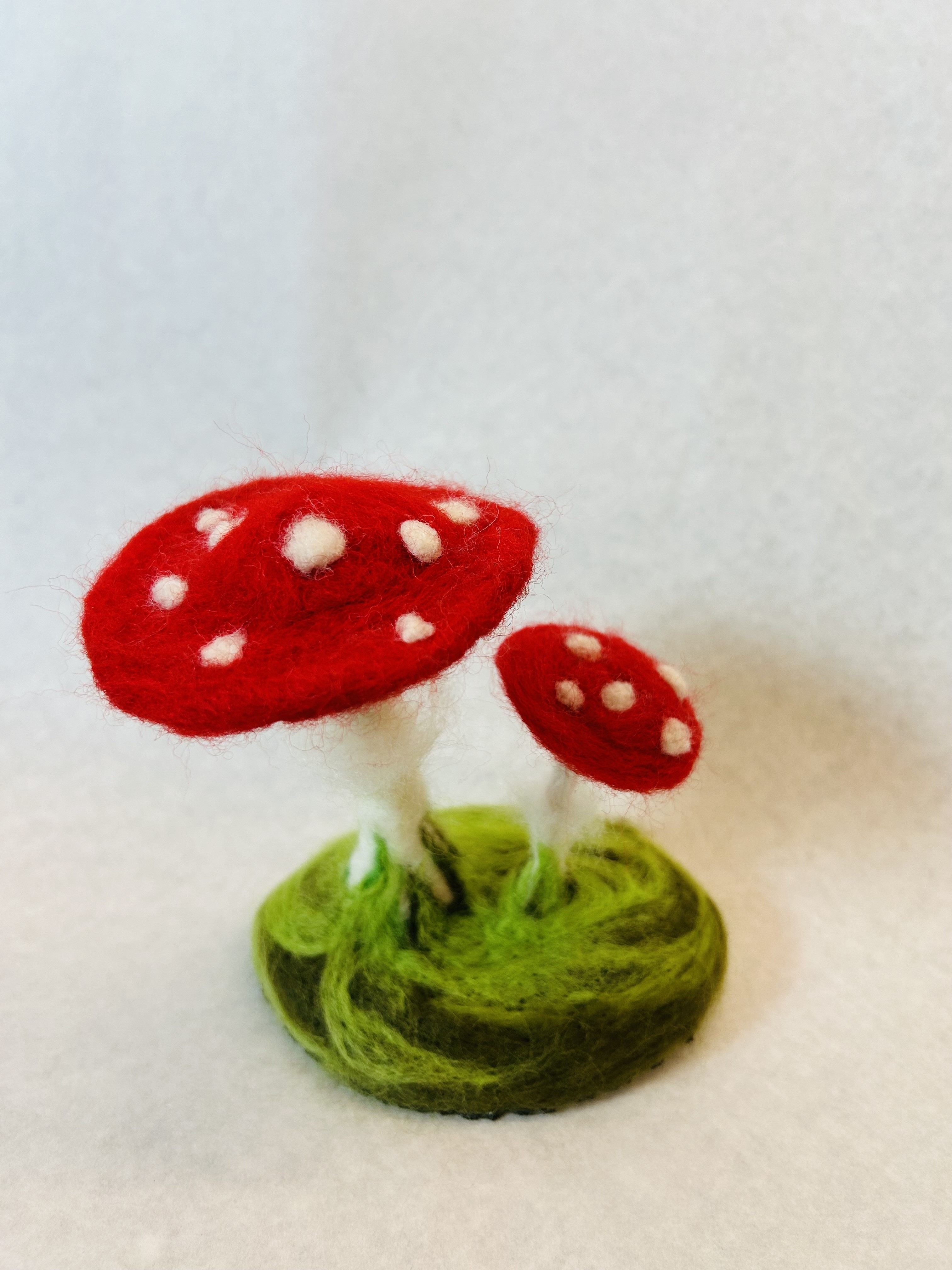 red cap felted mushroom with white stems