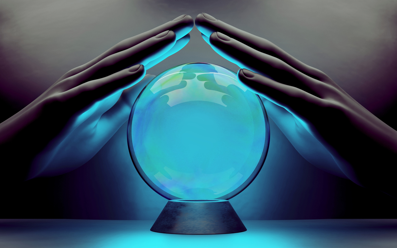 A pair of hands surrounding a crystal ball.