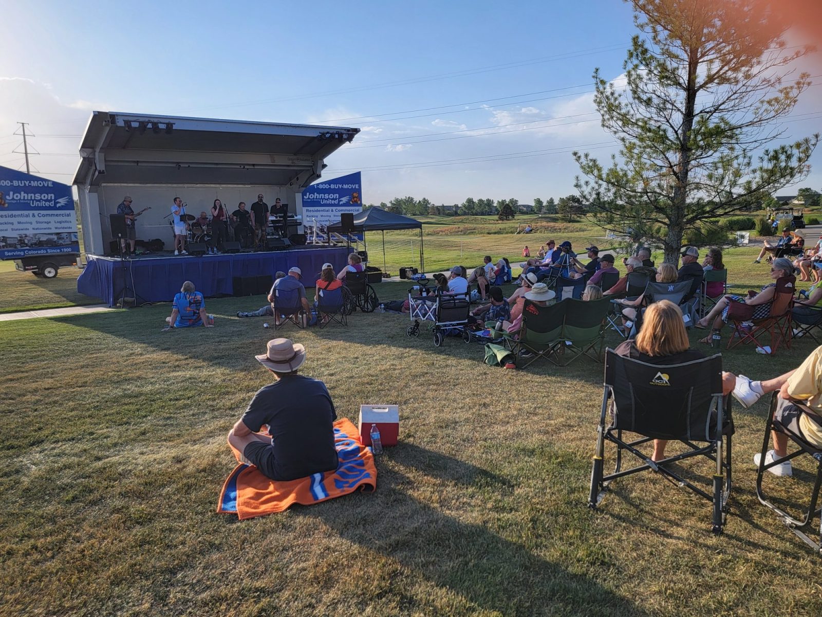 A band plays on the stage at Ute Creek Golf Course