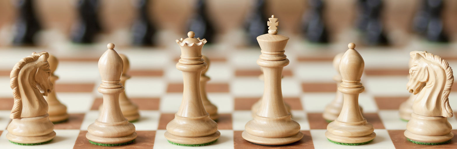 white chess pieces on a chess board