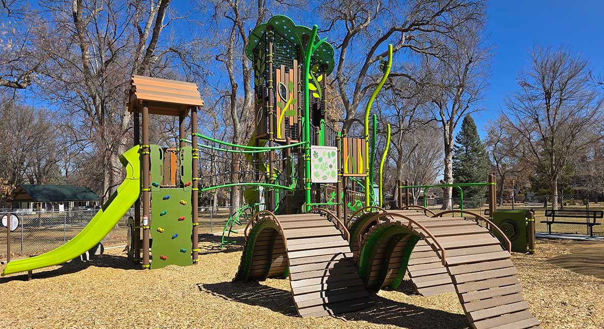 A colorful play structure is located in city park.
