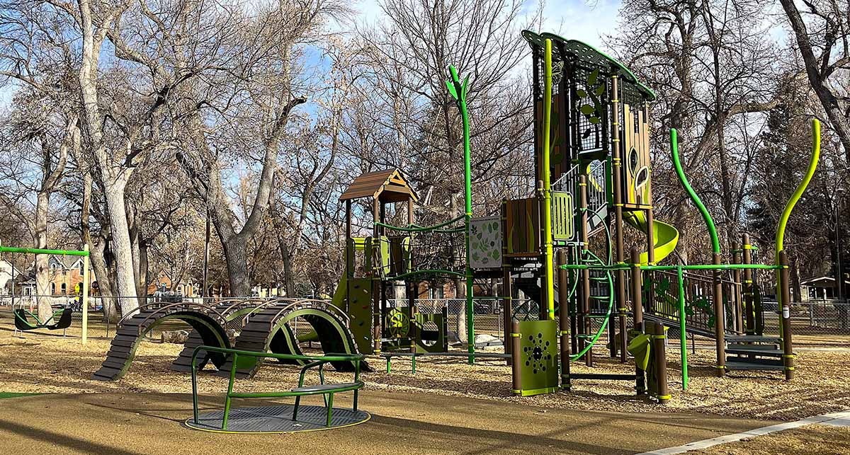A new play structure in Thompson Park, completed winter 2025, is seen in early spring before the trees have begun to bloom.
