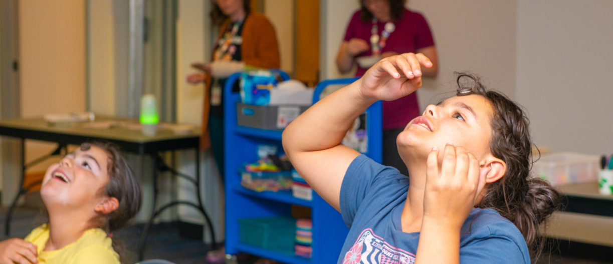 tweens playing a game at the Library