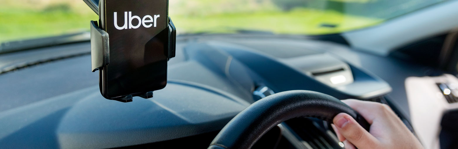 Uber car with phone and Uber logo