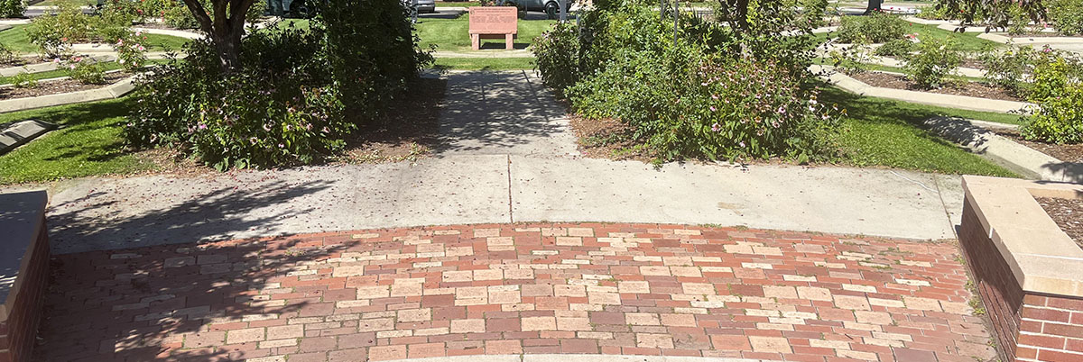 Memorial bricks, honoring loved ones, are seen in Longmont's Roosevelt Garden Rose Gardens