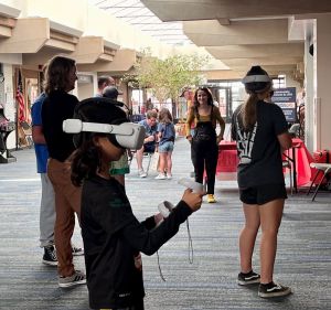 Girl in VR goggles at LevelUp Longmont, facing right