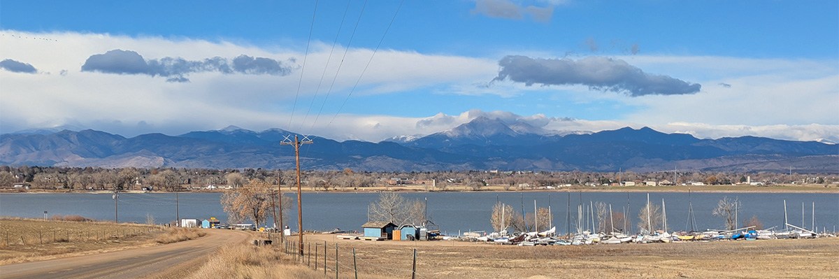 Photo shows a portion of Longmont's Union Reservoir with the foothills in the background.