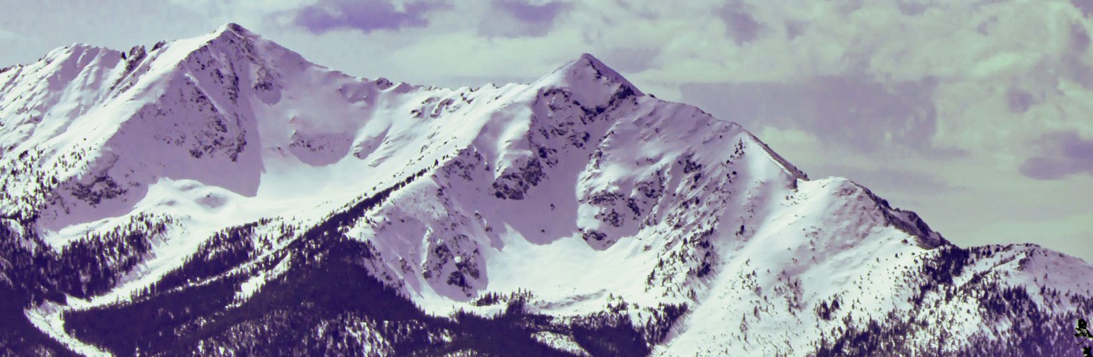 snow capped mountains in a rugges colorado setting