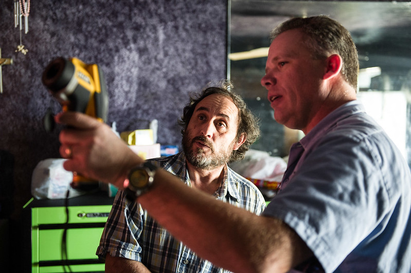 photo of two people looking at a thermal camera