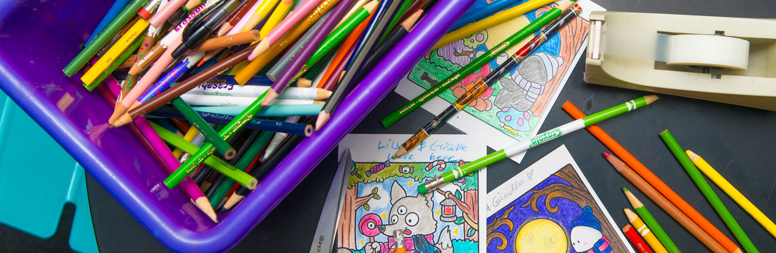 teen room collage of colored pencils, a tape dispenser and cards that have been colored by teens at the library