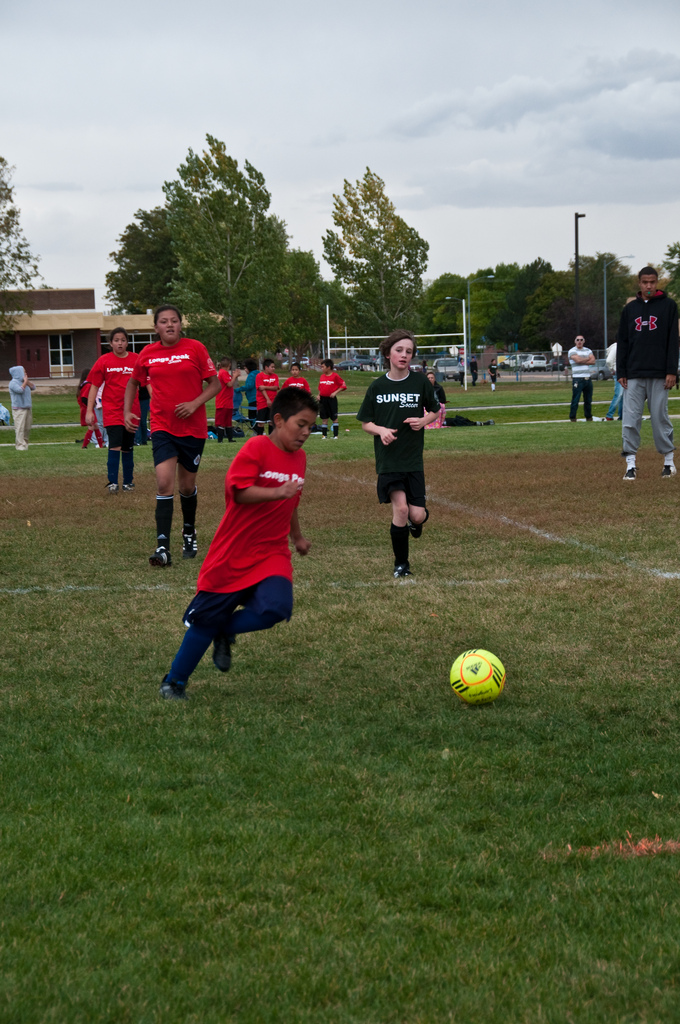 young kids playing soccer