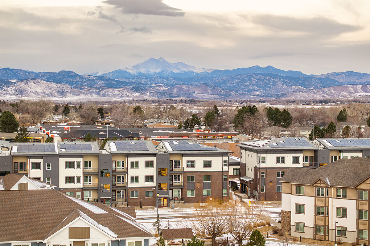 Photos of Ascent at Hover Crossing showing roofs with solar panels against a mountain horizon,