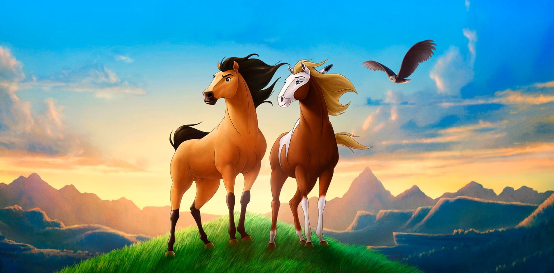 Image of Spirit and Rain from Spirit: Stallion of the Cimarron movie. The two horses appear on a grassy hill against a picturesque background with a mountain range, sunset, and eagle flying above.