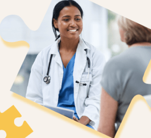 female doctor in a white coat smiling