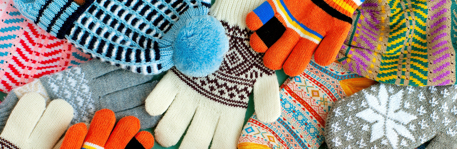 selection of colorful hats and loves for winter