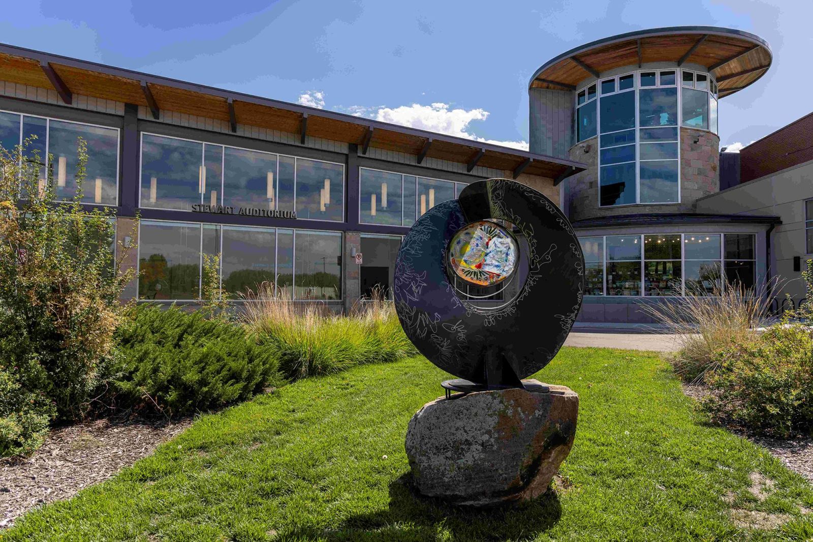 An exterior image of the Longmont Museum's expanded building featuring public art
