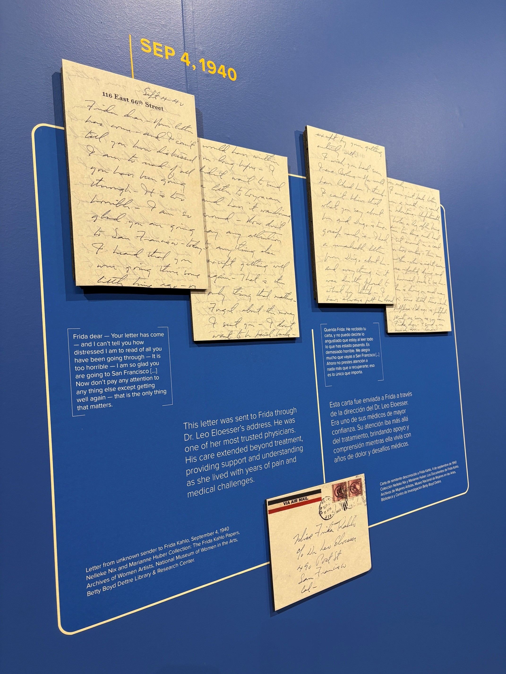 A gallery wall showing personal letters written by Frida Kahlo